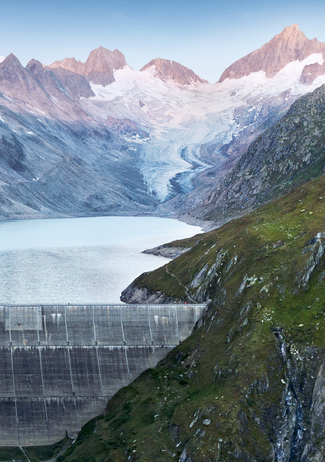 Dam with lake and glacier in the background